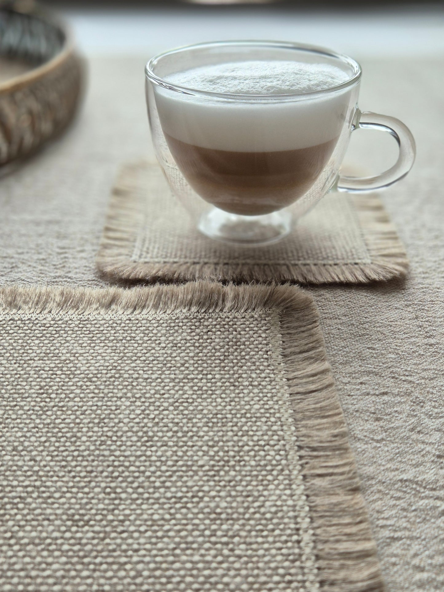 Aria natural stone pure linen textured coasters with hand brushed edges.
