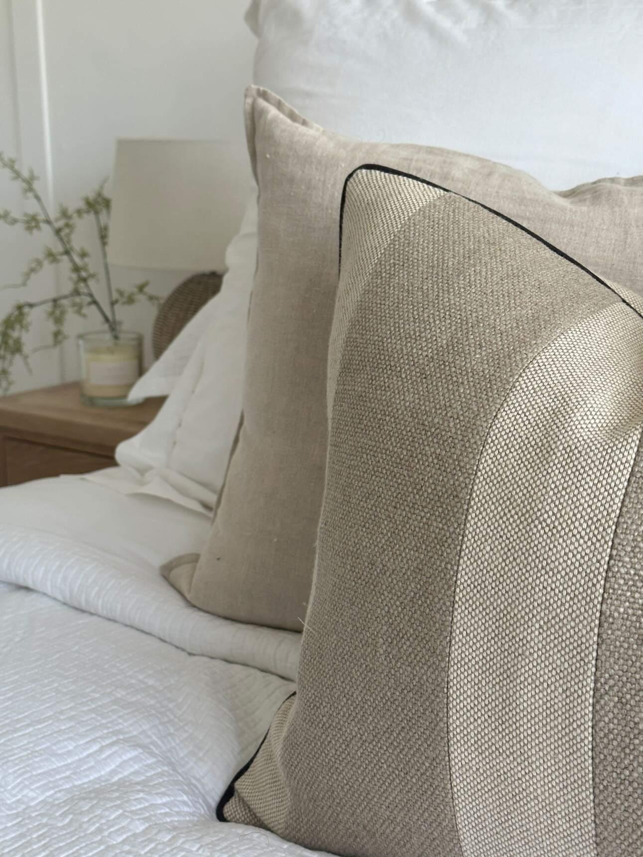 Elegant pure linen bed cushion covers in heavily woven neutral brown and beige colour.