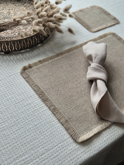 Aria natural stone pure linen textured placemat with hand brushed edges.