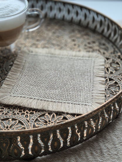 Aria natural stone pure linen textured coasters with hand brushed edges.