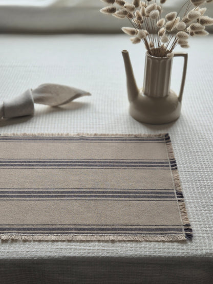 Striped linen placemat with frayed edges
