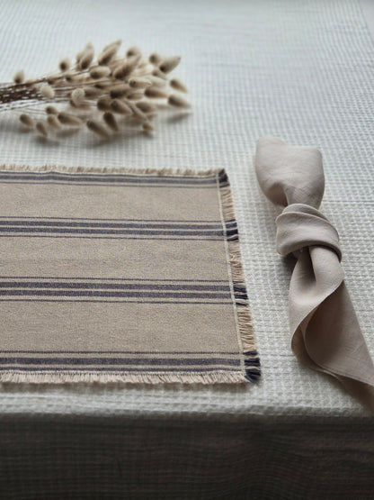 Striped linen placemat with frayed edges