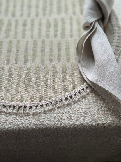 Mia round linen placemat in naturals tone and soft sage green colour with linen fringe trim