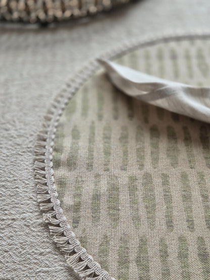 Mia round linen placemat in naturals tone and soft sage green colour with linen fringe trim