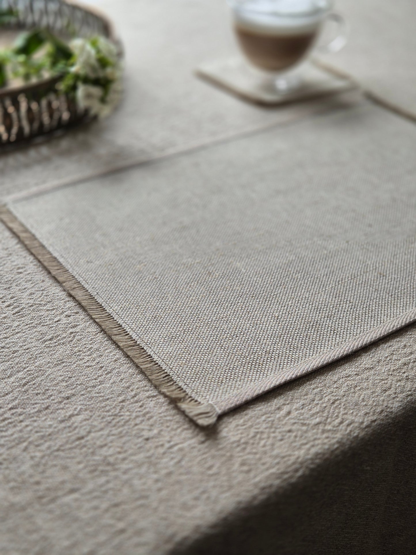 Sara oatmeal pure linen textured placemat with hand brushed edges.
